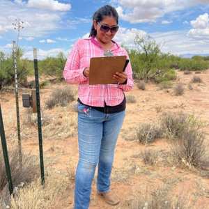 Student writing down research findings